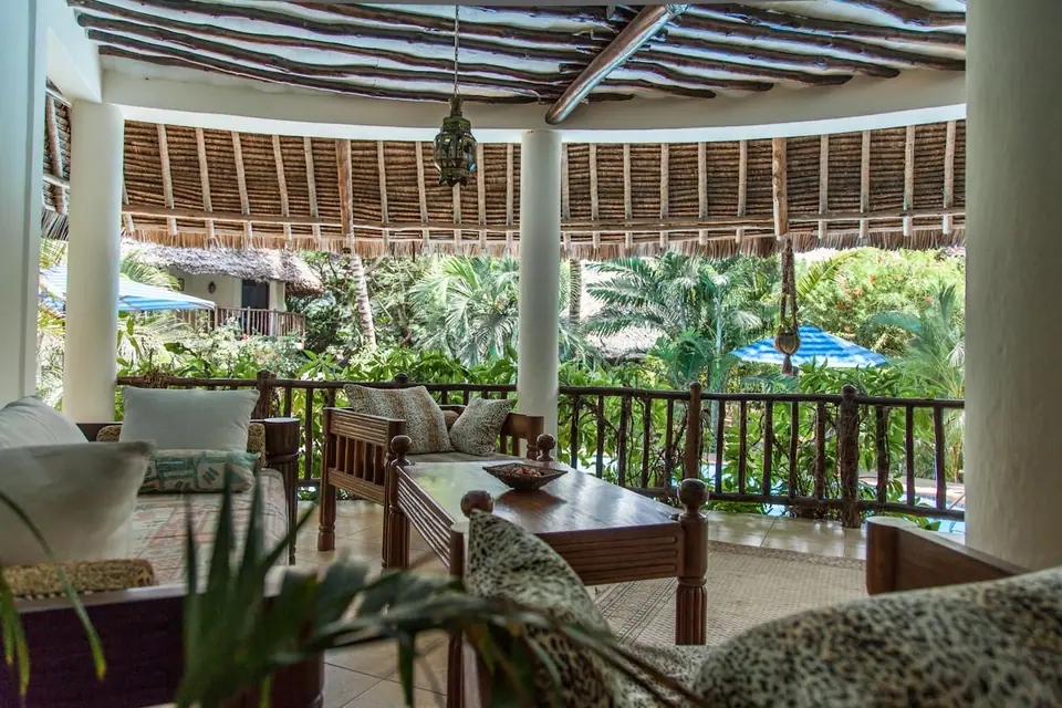 Upstairs veranda lounge overlooking the pool and garden