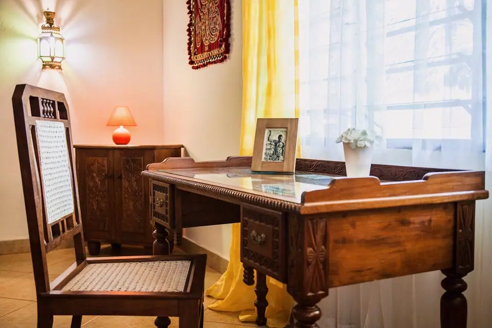 Hand-carved wooden desk and chair in the villa
