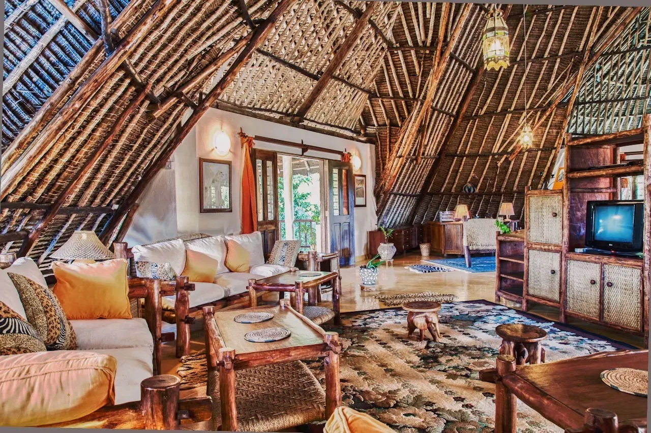 Open living area under a soaring makuti roof