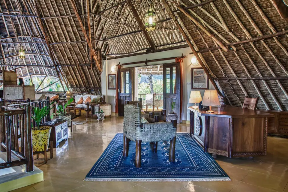 Open study and lounge beneath the makuti roof